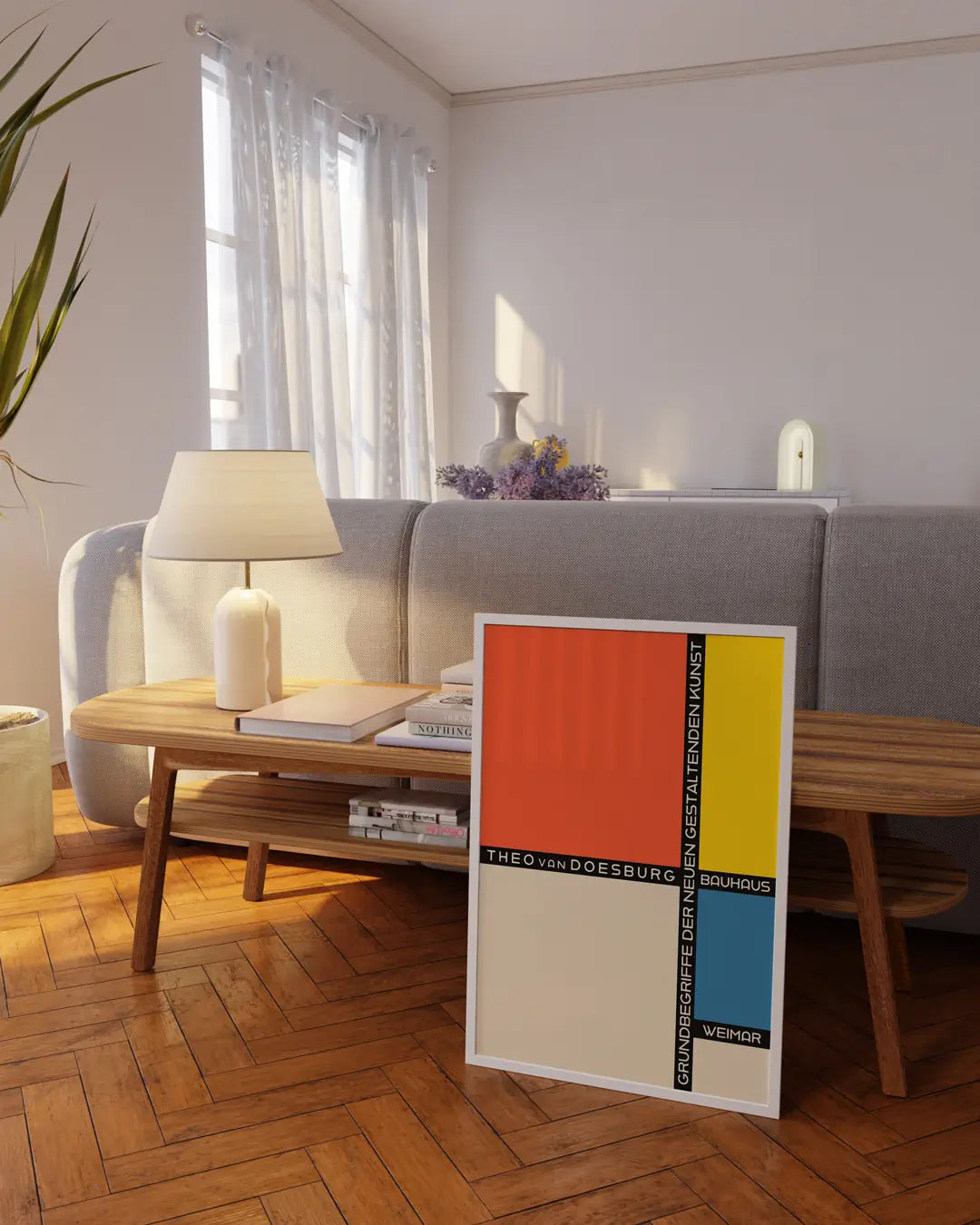 リビングルームに飾られたホワイトフレームのバウハウス・パッチワークポスター。幾何学的な構成と配色が空間に調和するモダンアートポスター。