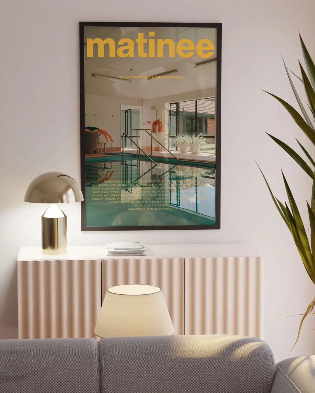 リビングの壁に掛けられたブラックフレームの「Matinee」ポスター。落ち着いた色彩と洗練された構図が空間に調和するモダンアートポスター。