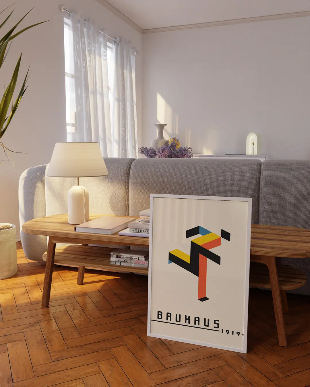 リビングに飾られたホワイトフレームの「Running Bauhaus」ポスター。動きとリズムを感じさせるバウハウス調のモダンアートポスター。